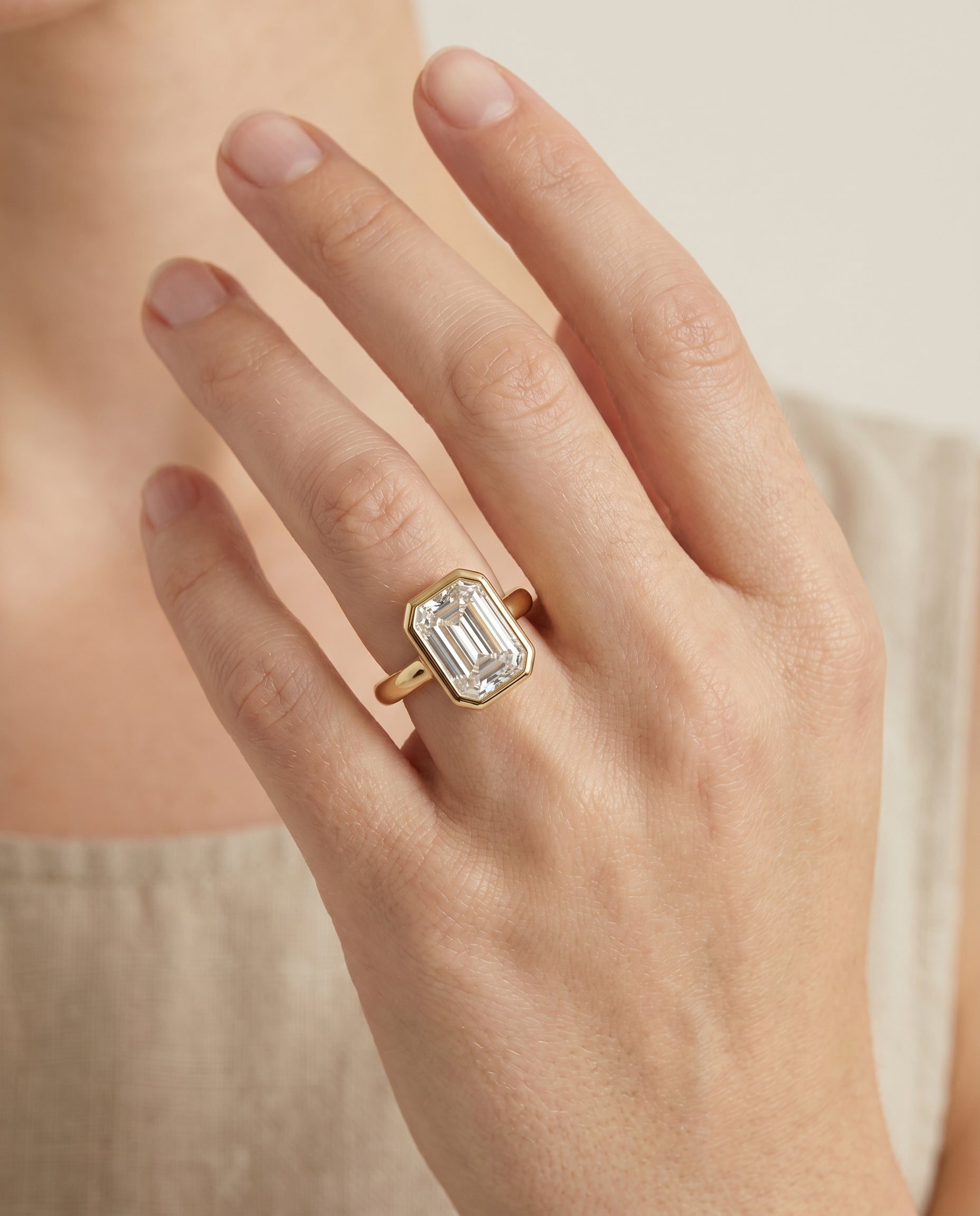 The Agnes engagement ring setting in 18K Yellow Gold, bezel solitaire in cut design | RockHer