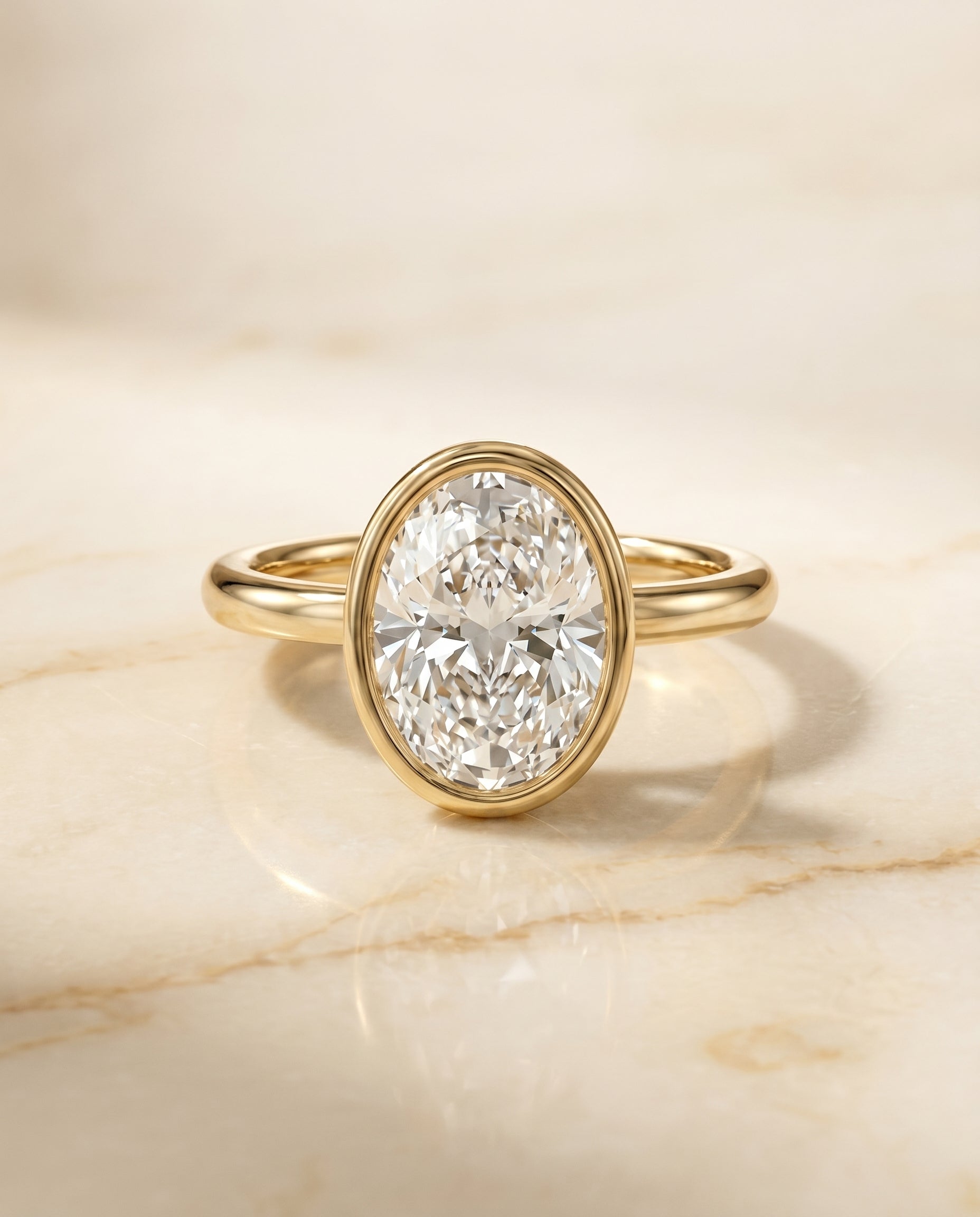 The Agnes Bezel Solitaire Engagement Ring Setting for Oval Diamonds in 18K Yellow Gold | RockHer
