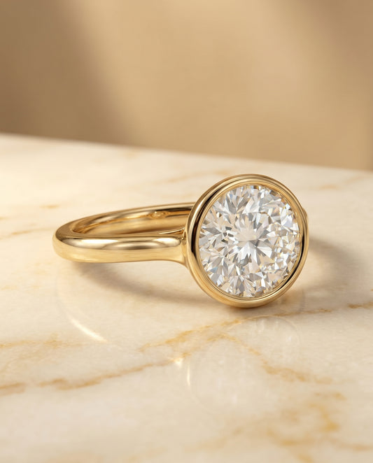 Agnes Round Brilliant Bezel Solitaire in 18K Yellow Gold | RockHer