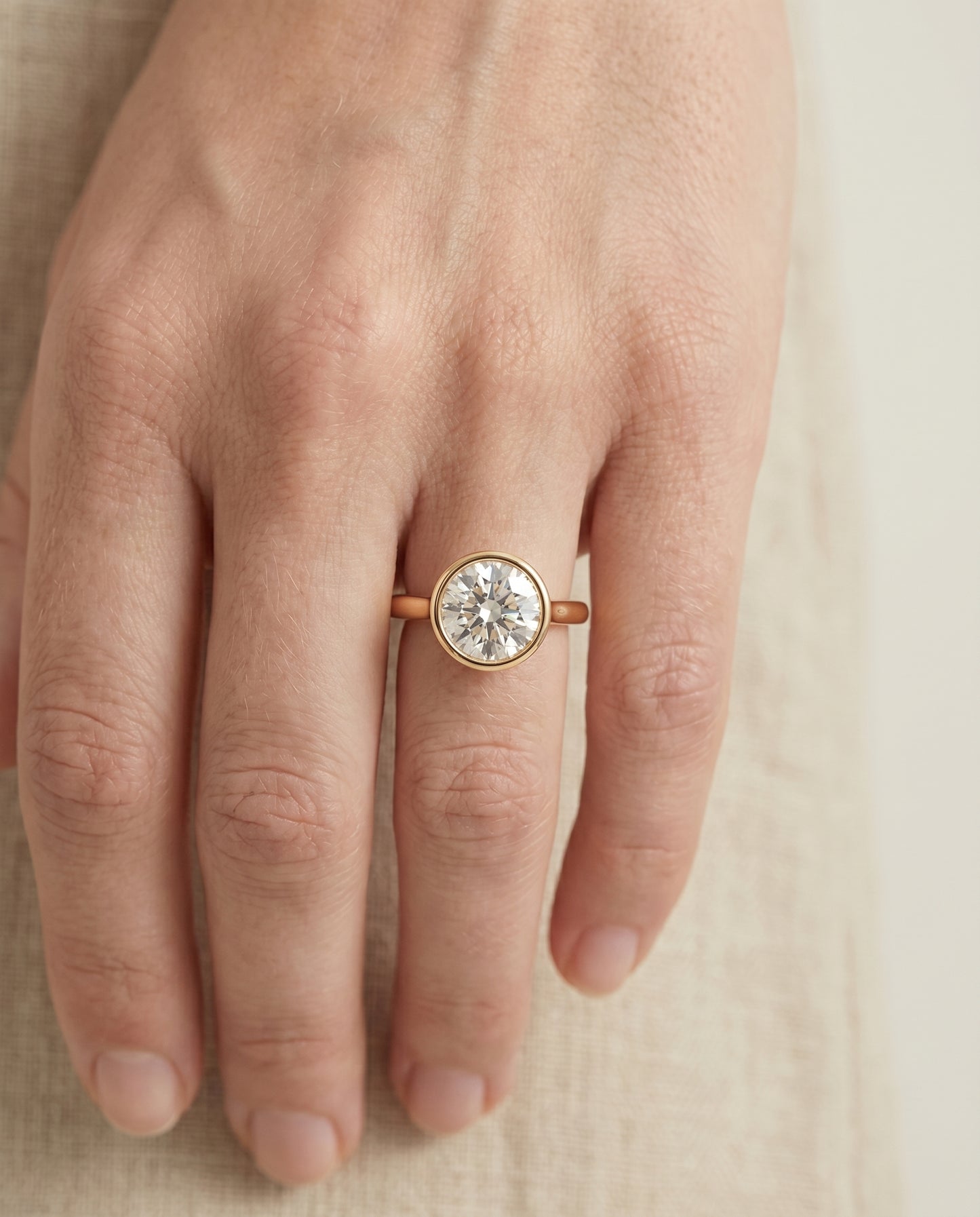 Agnes Round Brilliant Bezel Solitaire in 18K Yellow Gold