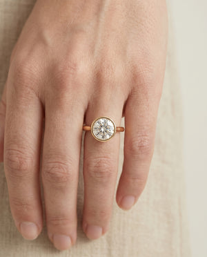 Agnes Round Brilliant Bezel Solitaire in 18K Yellow Gold