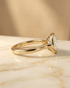 Agnes Round Brilliant Bezel Solitaire in 18K Yellow Gold