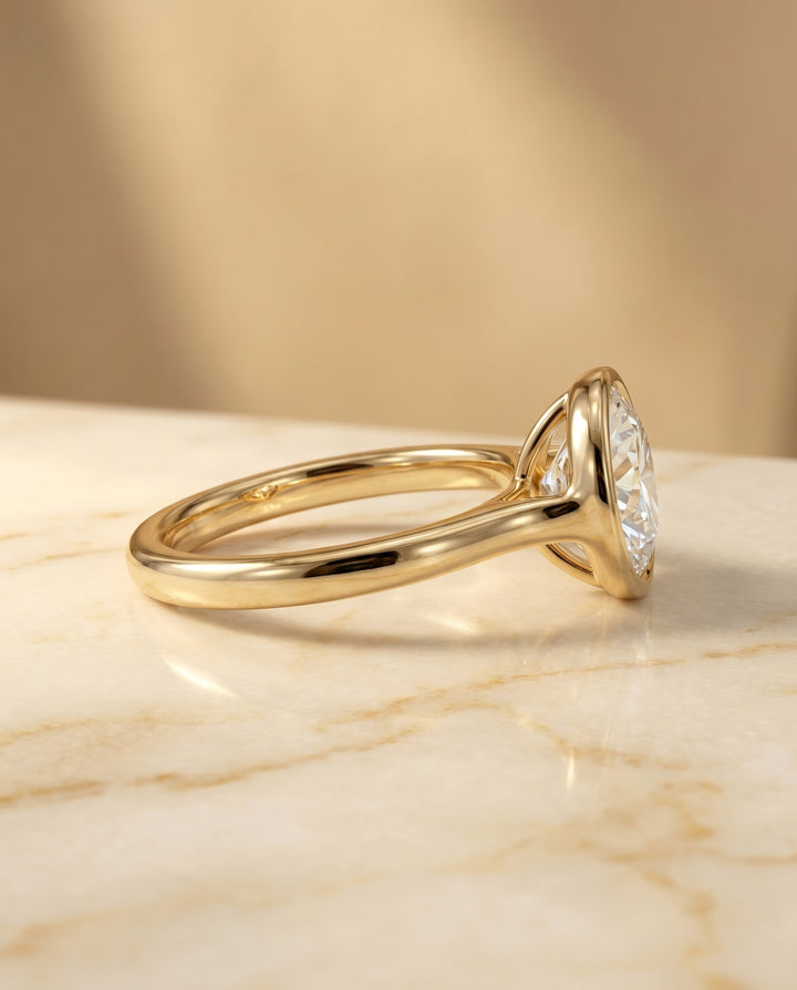 Agnes Round Brilliant Bezel Solitaire in 18K Yellow Gold