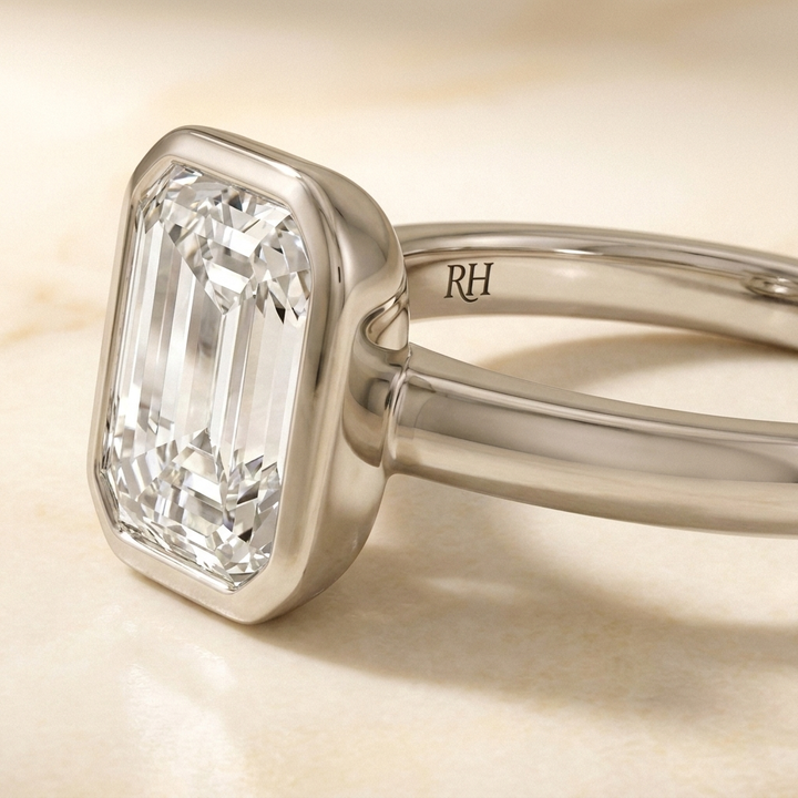 The Agnes Select bezel solitaire emerald cut engagement ring in platinum — construction detail — RockHer