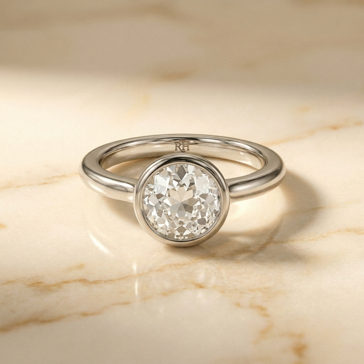 The Agnes bezel solitaire old european cut engagement ring setting in platinum — front view — RockHer