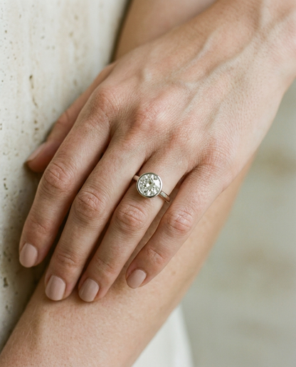 The Agnes bezel solitaire old european cut engagement ring setting in 18k white gold — on hand — RockHer