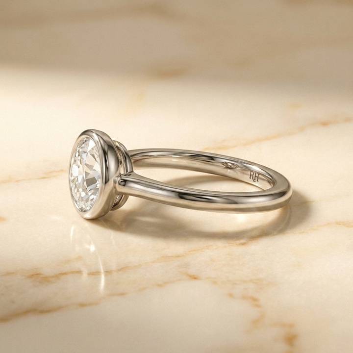 The Agnes Select bezel solitaire old european cut engagement ring in 18k white gold — side profile — RockHer