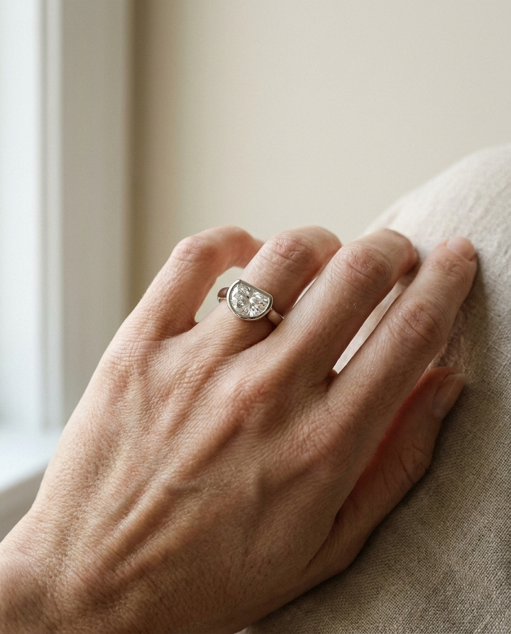 The Agnes Select bezel solitaire half cut engagement ring in platinum — on hand — RockHer