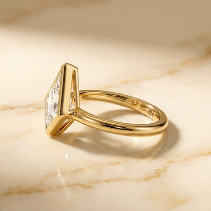The Agnes Select bezel solitaire kite engagement ring in 18k yellow gold — side profile — RockHer