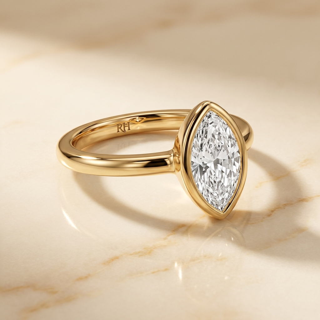 The Agnes Select bezel solitaire marquise engagement ring in 18k yellow gold — alt-angle hero — RockHer