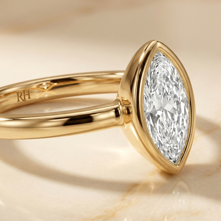 The Agnes Select bezel solitaire marquise engagement ring in 18k yellow gold — construction detail — RockHer