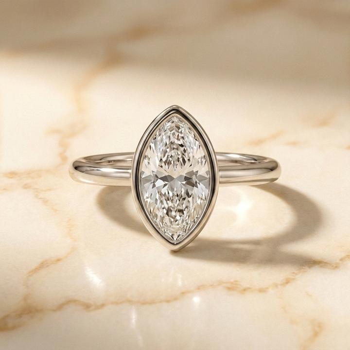 The Agnes Select bezel solitaire marquise engagement ring in platinum — front view — RockHer