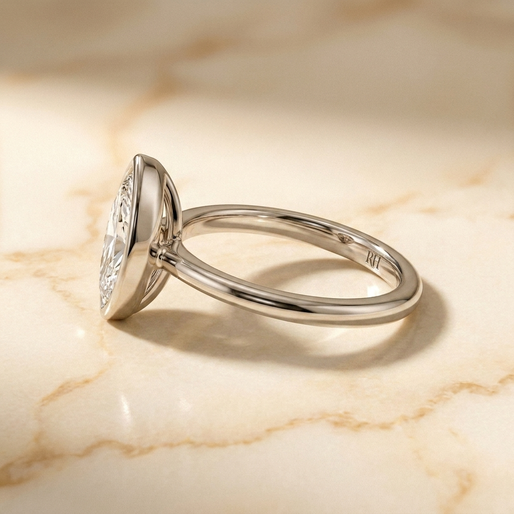 The Agnes Select bezel solitaire marquise engagement ring in platinum — side profile — RockHer