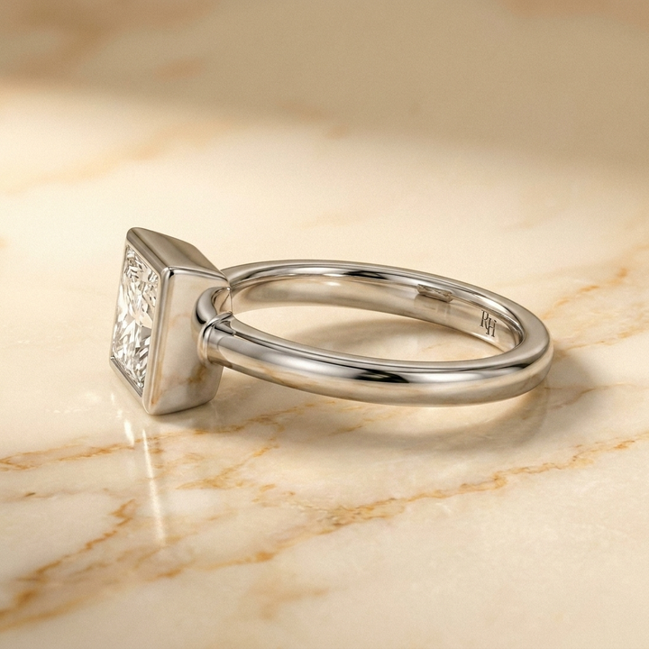 The Agnes Select bezel solitaire princess engagement ring in 18k white gold — side profile — RockHer