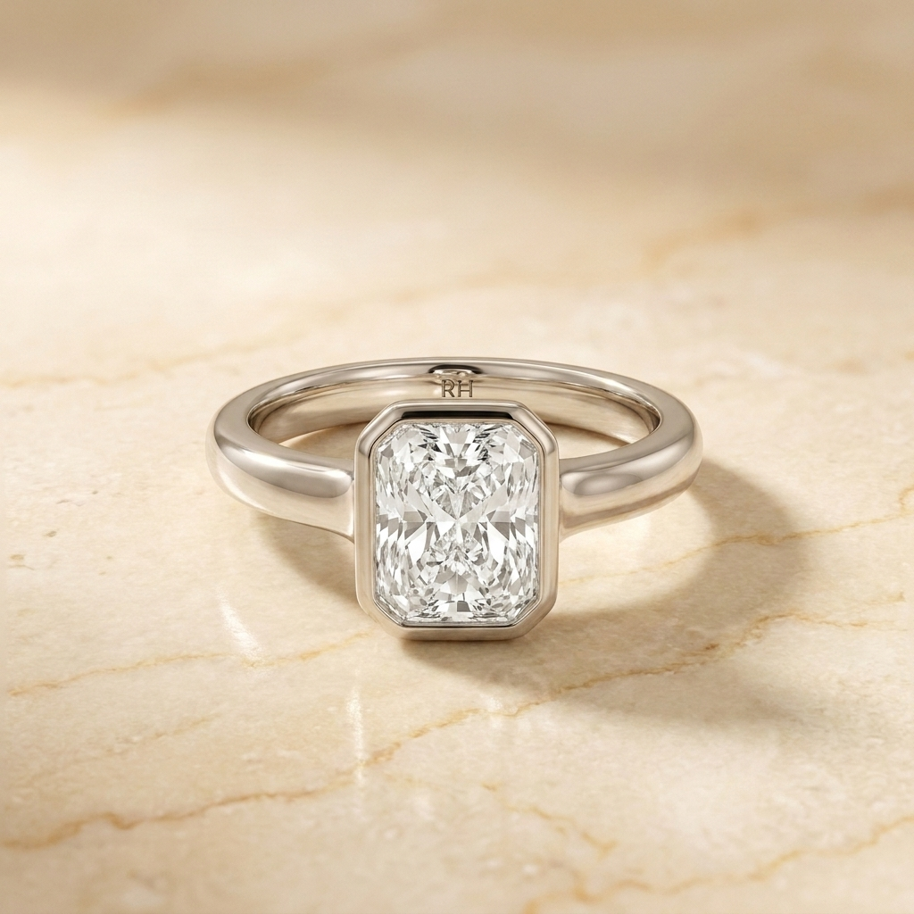 The Agnes Select bezel solitaire radiant engagement ring in platinum — front view — RockHer