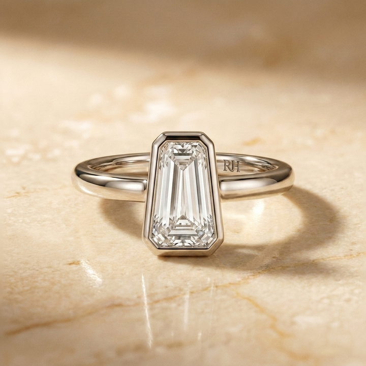 The Agnes Select bezel solitaire tapered baguette engagement ring in 18k white gold — front view — RockHer