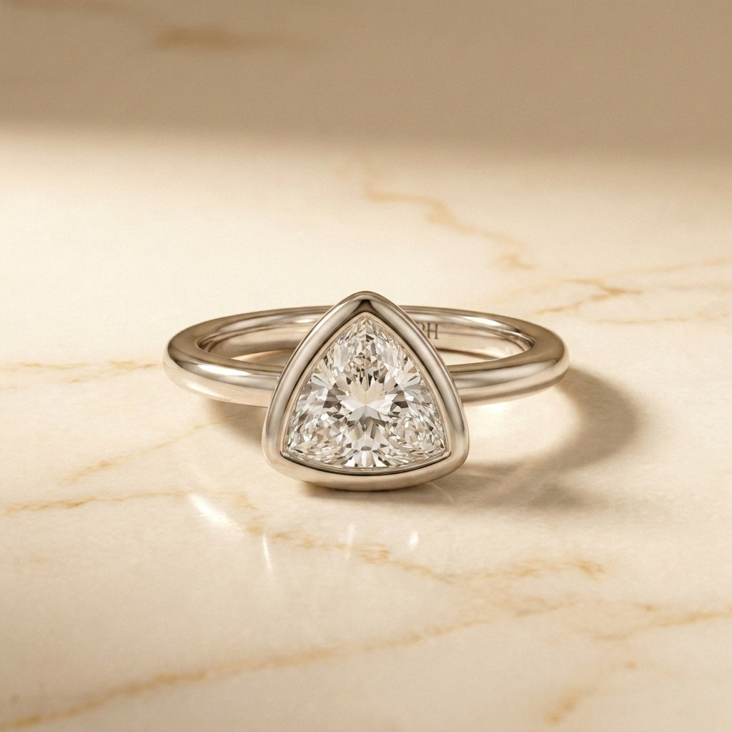 The Agnes bezel solitaire trillion engagement ring setting in 18k white gold, front view, RockHer