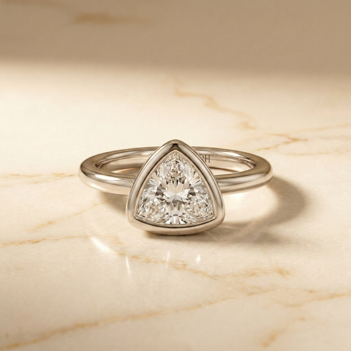 The Agnes bezel solitaire trillion engagement ring setting in 18k white gold — front view — RockHer