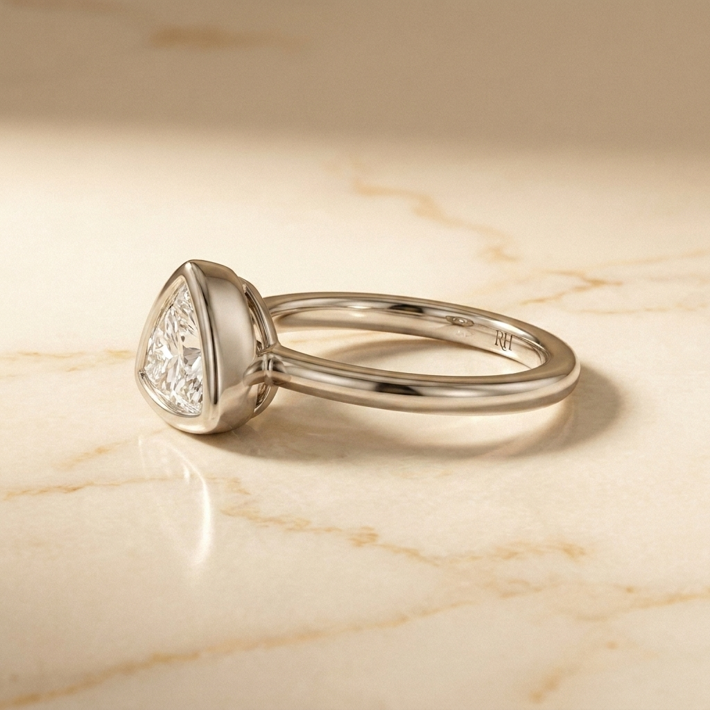 The Agnes bezel solitaire trillion engagement ring setting in 18k white gold, side profile, RockHer