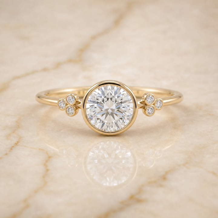The Selena Clover Bezel Accent Solitaire Round Engagement Ring Setting in 18K Yellow Gold