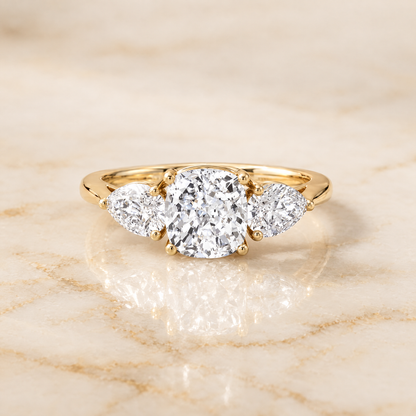 The Angelica Three Stone Matched Cushion Cut Engagement Ring Setting in 18K Yellow Gold