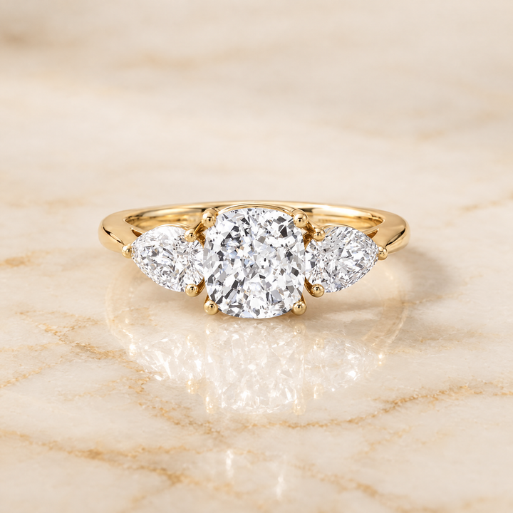 The Angelica Three Stone Matched Cushion Cut Engagement Ring Setting in 18K Yellow Gold