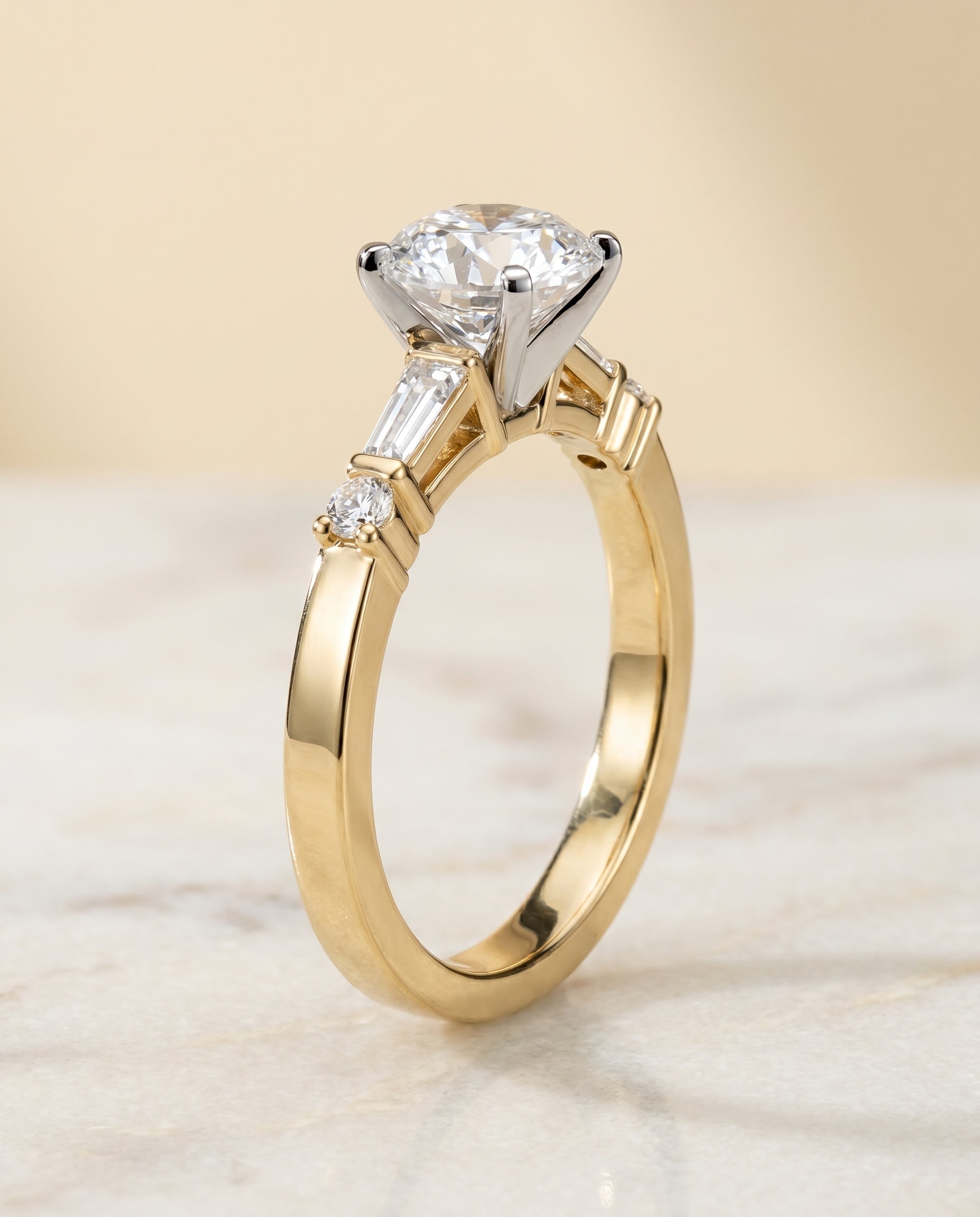 Tapered Baguette Three Stone styling on The Diana round engagement ring setting | RockHer