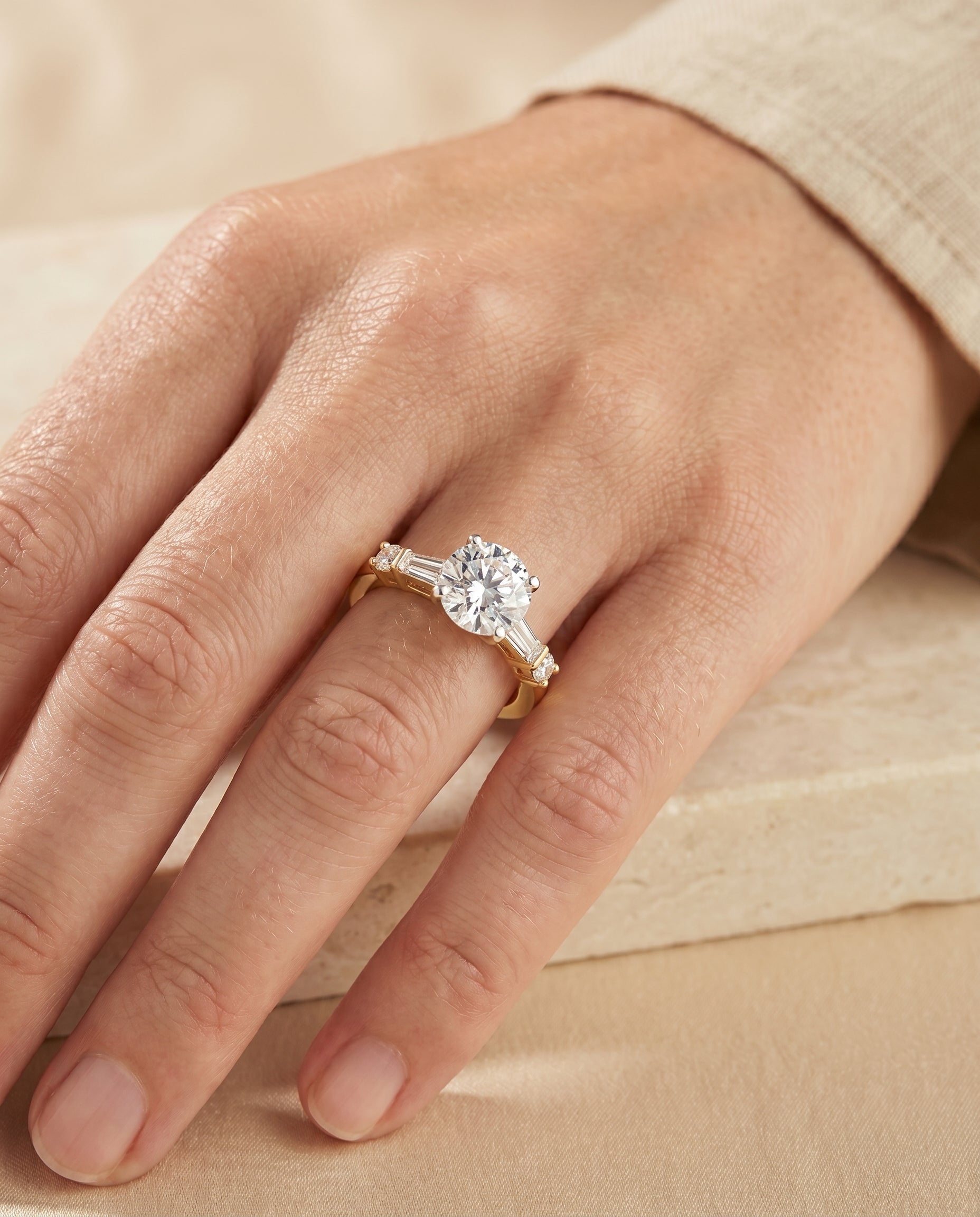 The Diana engagement ring setting in 18K Yellow Gold, tapered baguette three stone design | RockHer