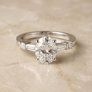 The Diana Tapered Baguette Three Stone Oval Engagement Ring Setting in Platinum