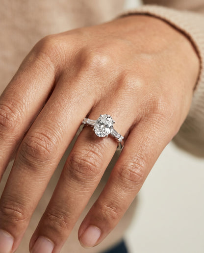 Diana Select Tapered Baguette Three Stone Oval Lab Diamond Engagement Ring in 18K White Gold, shown on hand | RockHer