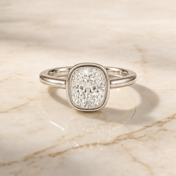 The Agnes Bezel Solitaire In Cushion Cut Engagement Ring Setting in 18K White Gold