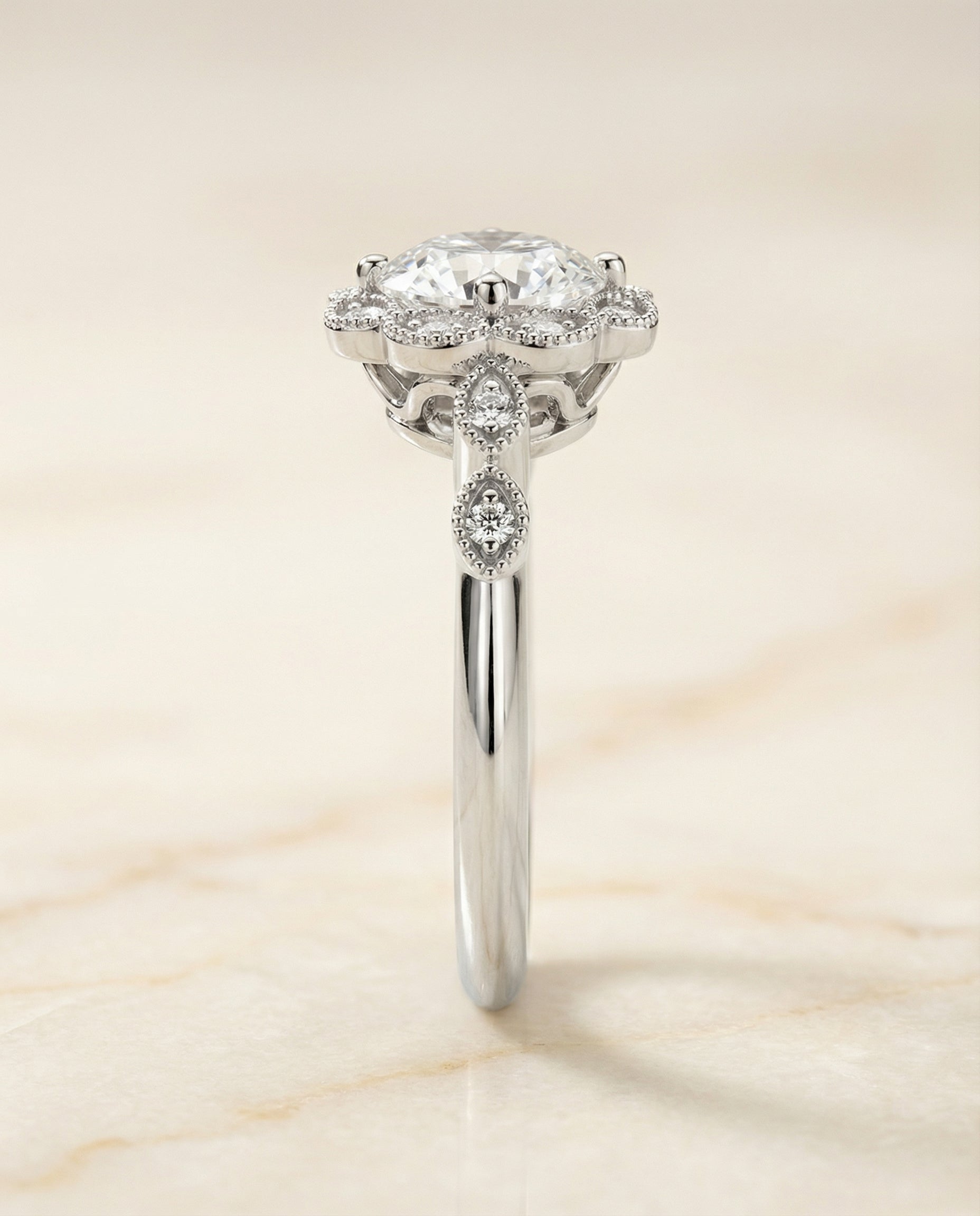 The Shania beaded floral halo leaf shoulders engagement ring setting, shown in 18K White Gold | RockHer