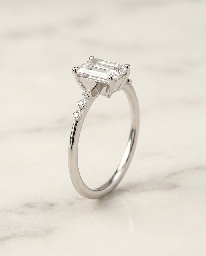 The Peggy Bezel Accent Solitaire Emerald Cut Engagement Ring Setting in Platinum