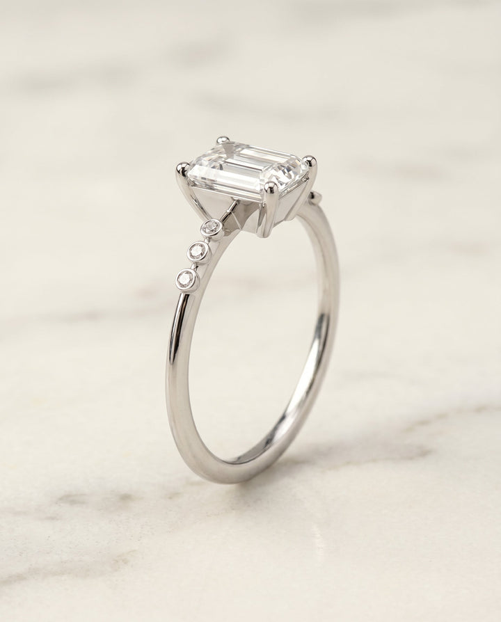 The Peggy Select Bezel Accent Solitaire Emerald Cut Engagement Ring with Lab Diamond in 18K White Gold — view 2