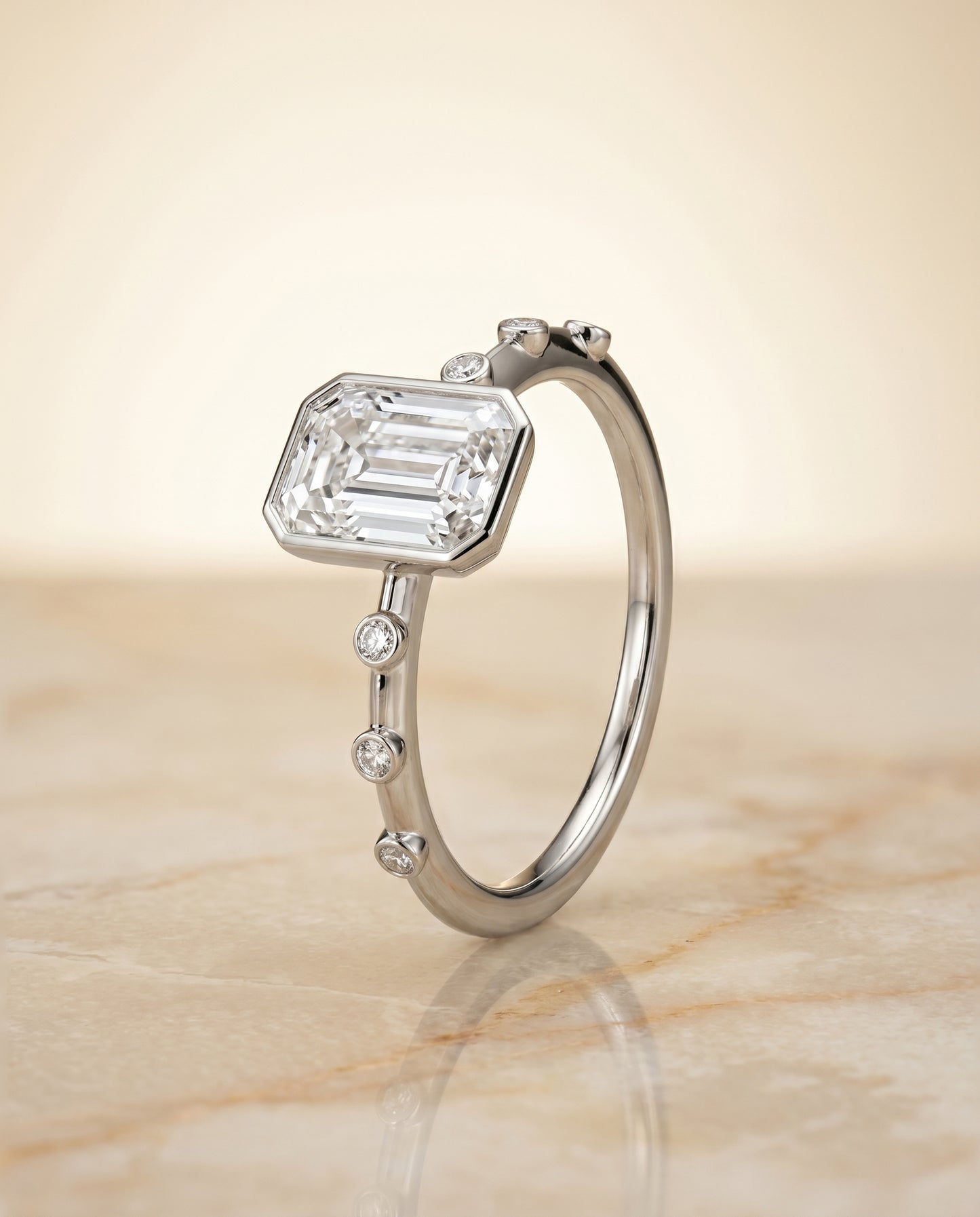 The Brandi Bezel Solitaire Engagement Ring Setting for Emerald Cut Diamonds in Platinum