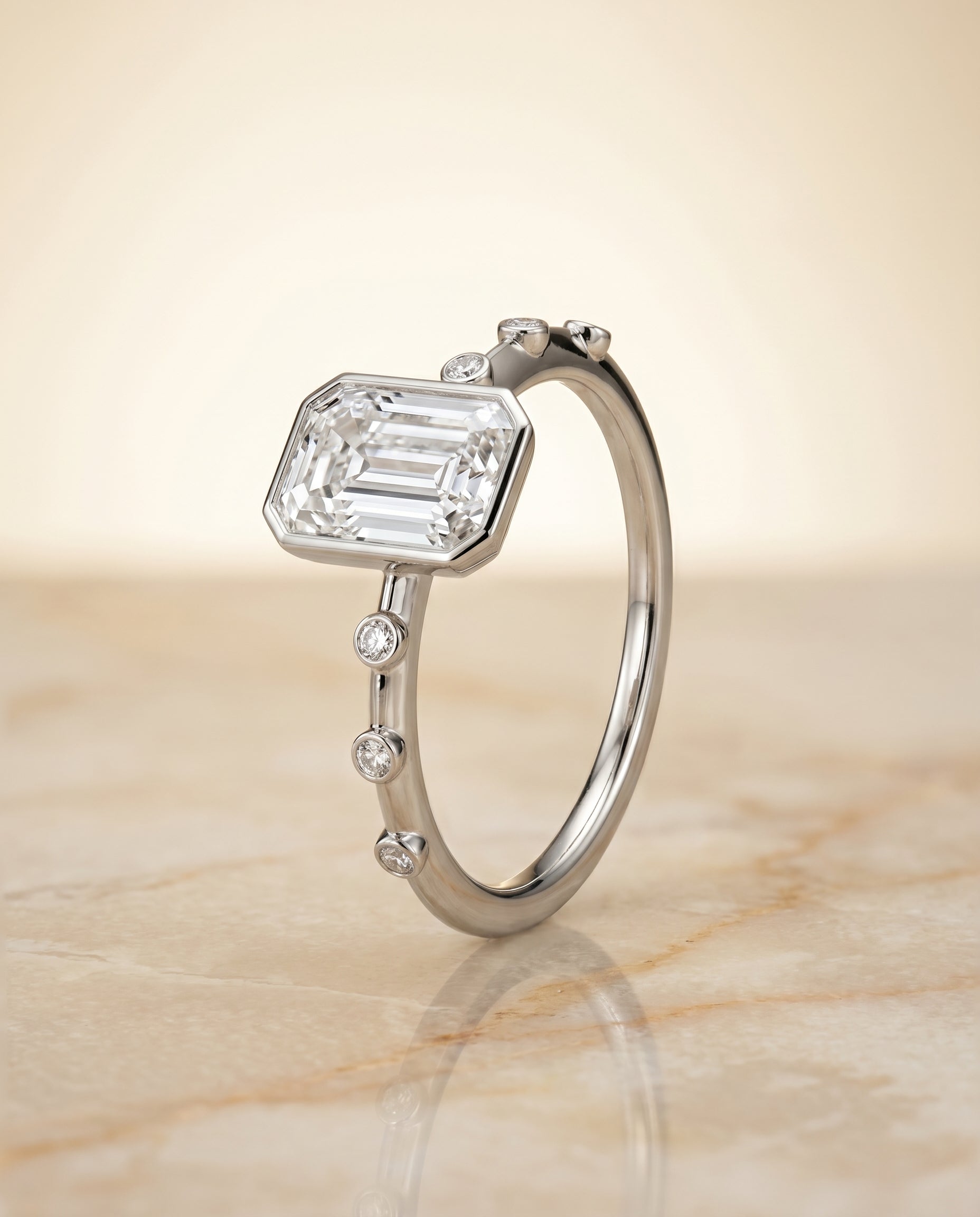 Bezel Accent Solitaire Cut styling on The Brandi emerald engagement ring setting | RockHer