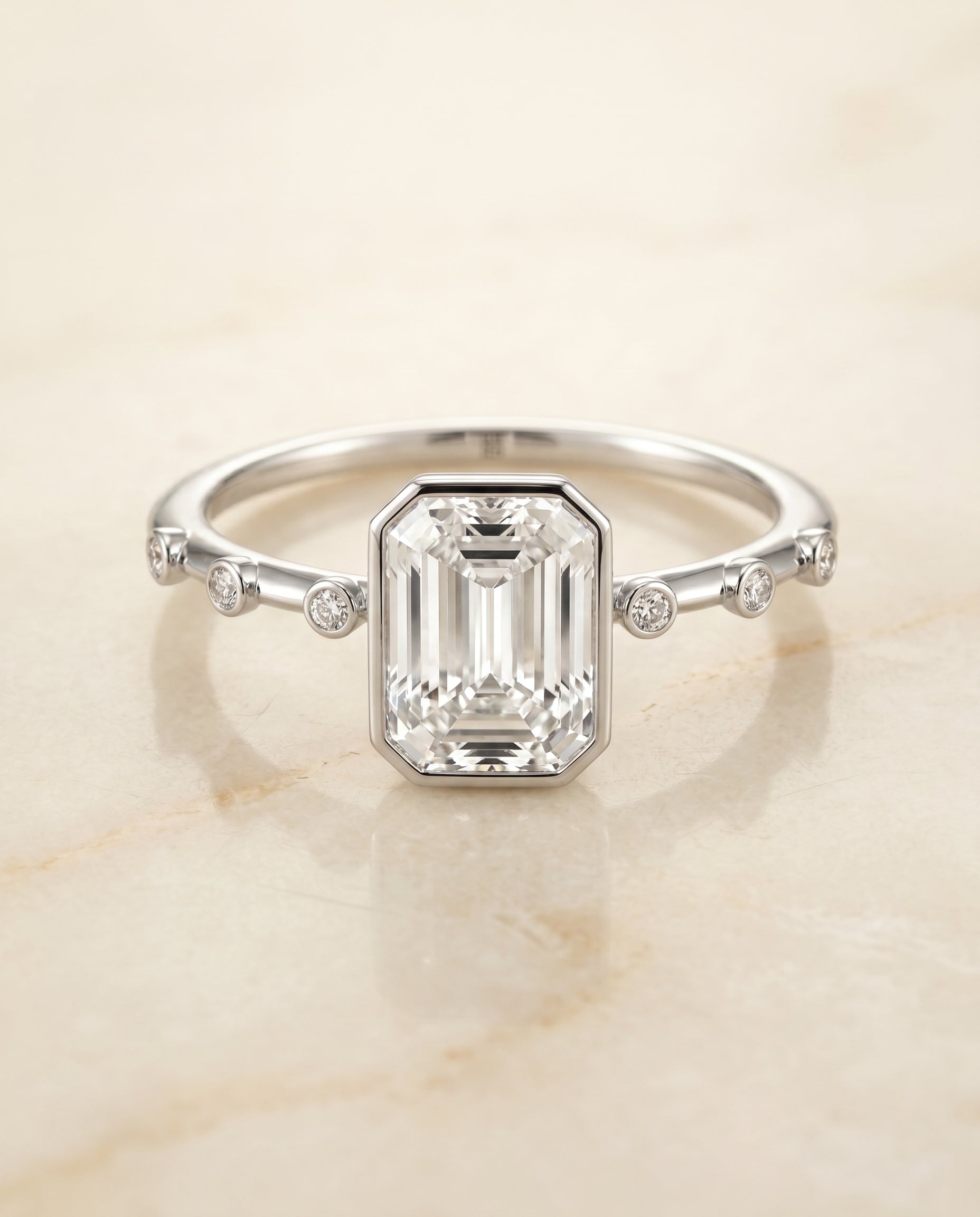 The Brandi Bezel Solitaire Engagement Ring Setting for Emerald Cut Diamonds in 18K White Gold | RockHer