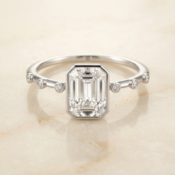 The Brandi Bezel Accent Solitaire Emerald Cut Engagement Ring Setting in 18K White Gold
