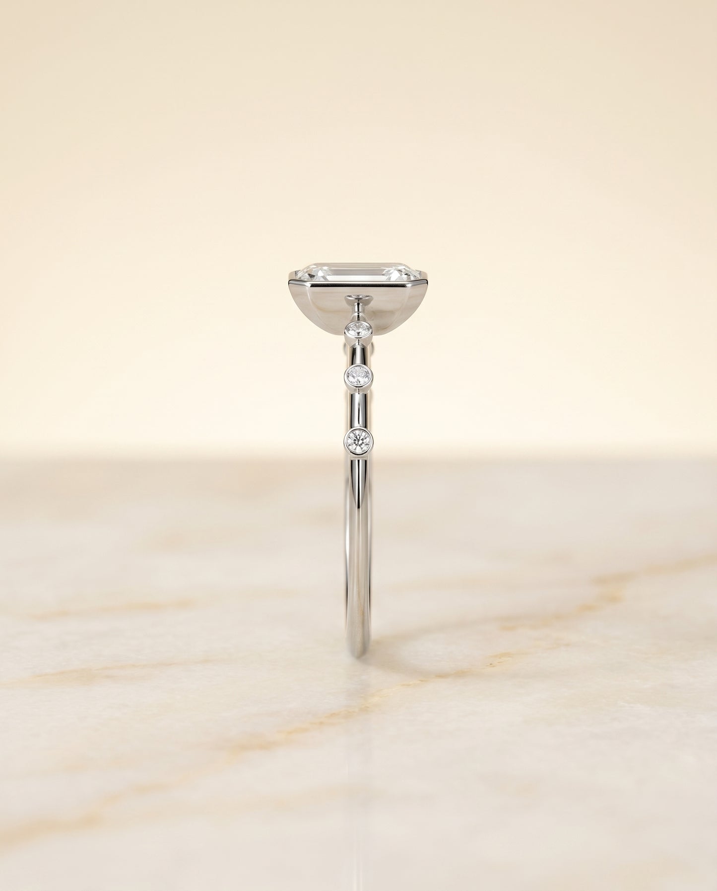 The Brandi Bezel Solitaire Engagement Ring Setting for Emerald Cut Diamonds in Platinum
