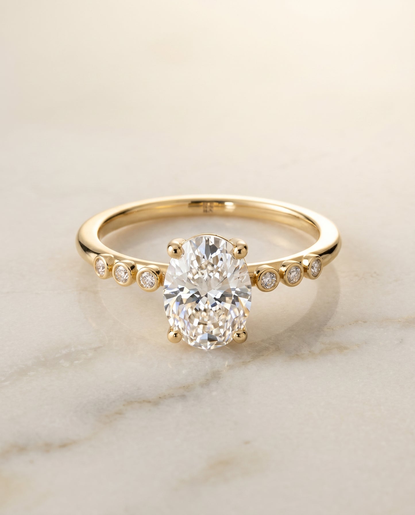 The Peggy Bezel Solitaire Engagement Ring Setting for Oval Diamonds in 18K Yellow Gold | RockHer