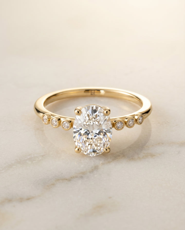 The Peggy Bezel Solitaire Engagement Ring Setting for Oval Diamonds in 18K Yellow Gold | RockHer