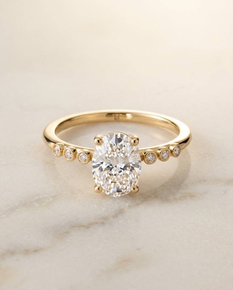 The Peggy Bezel Accent Solitaire Oval Engagement Ring Setting in 18K Yellow Gold