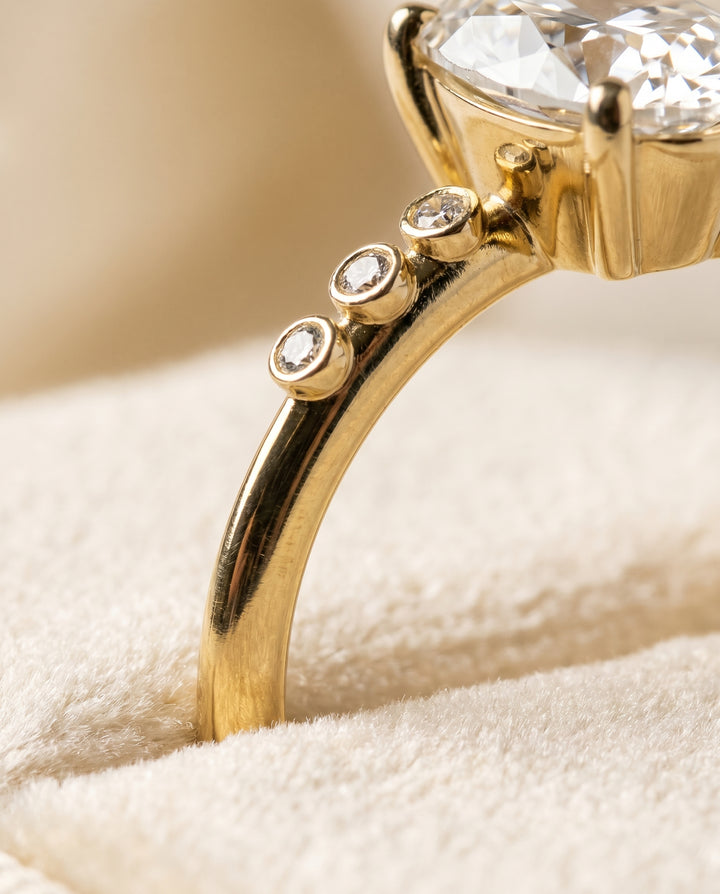 The Peggy Bezel Accent Solitaire Oval Engagement Ring Setting in 18K Yellow Gold