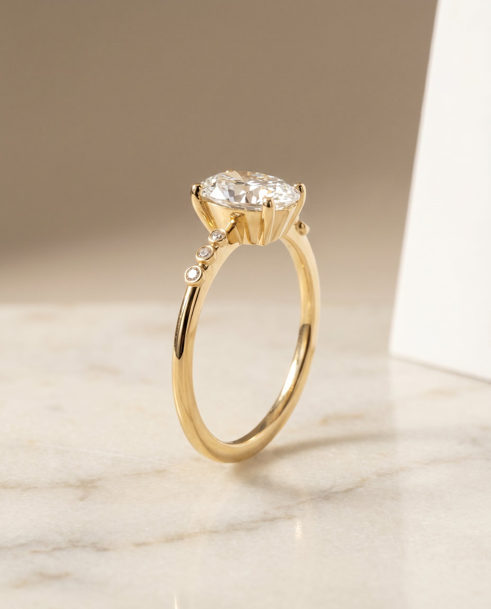 Bezel Accent Solitaire styling on The Peggy oval engagement ring setting | RockHer