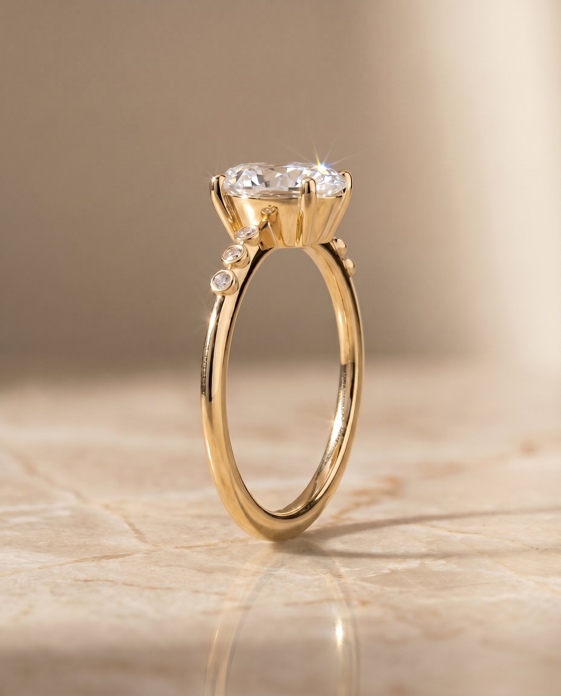 The Peggy bezel accent solitaire engagement ring setting, shown in 18K Yellow Gold | RockHer