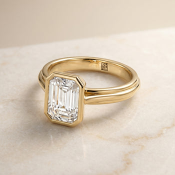 The Hayley Bezel Cathedral Solitaire Emerald Cut Engagement Ring Setting in 18K Yellow Gold