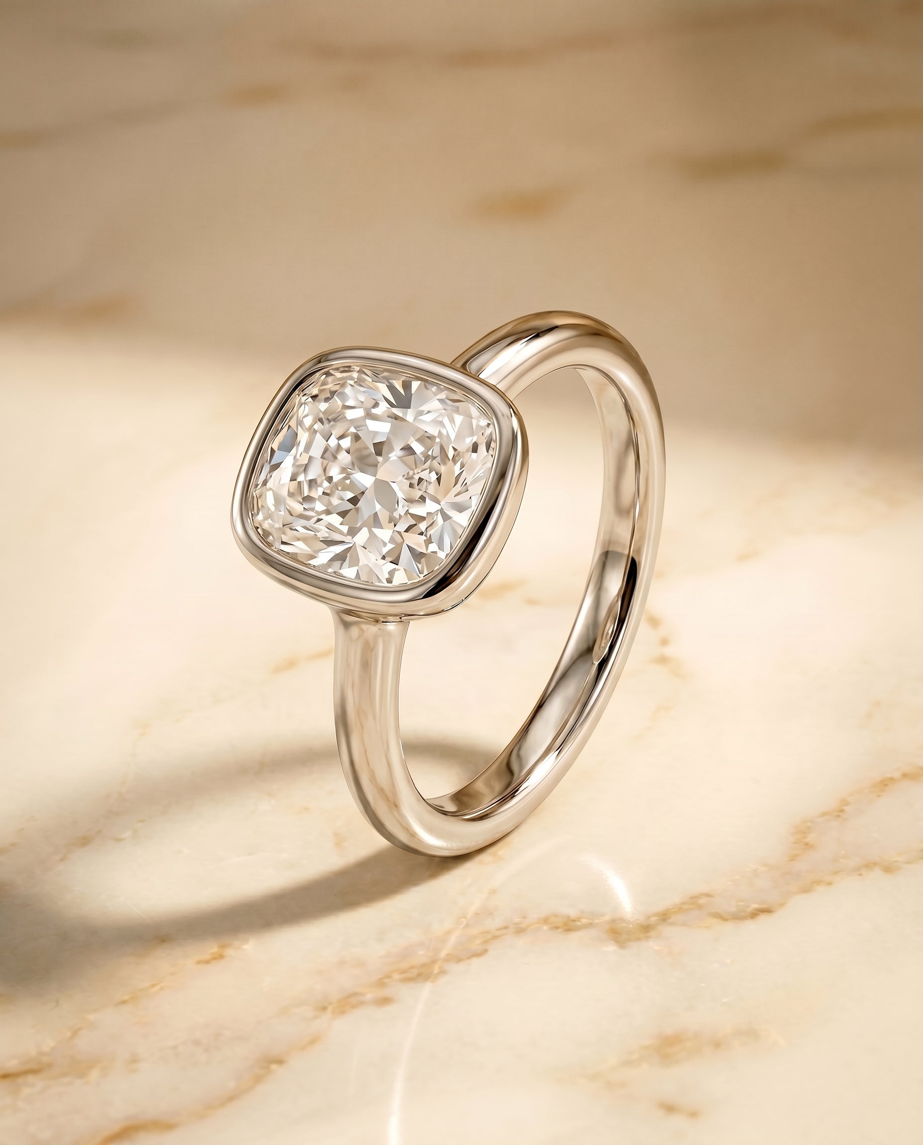Bezel Solitaire In Cut styling on The Agnes cushion engagement ring setting | RockHer