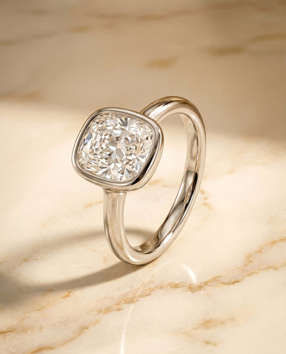 The Agnes Bezel Solitaire In Cushion Cut Engagement Ring Setting in Platinum