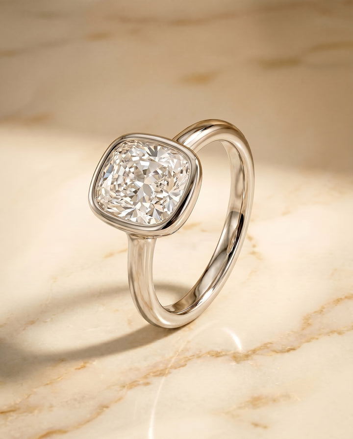 The Agnes Bezel Solitaire Engagement Ring Setting for Cushion Diamonds in Platinum