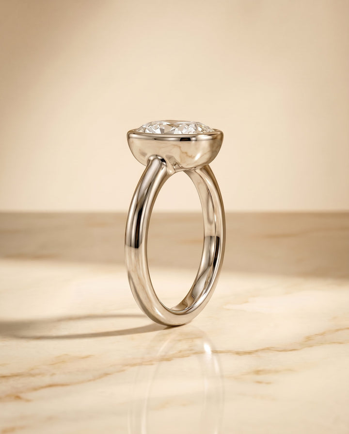 Agnes Select Bezel Solitaire In Cushion Cut Lab Diamond Engagement Ring in Platinum, side view | RockHer